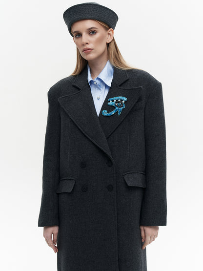 Wool coat with the blue eye patch