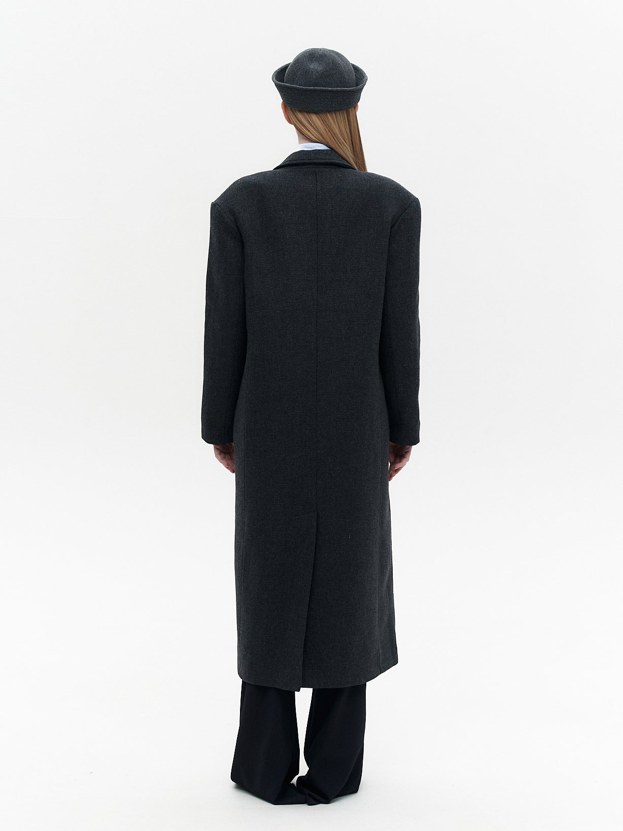 Wool coat with the blue eye patch