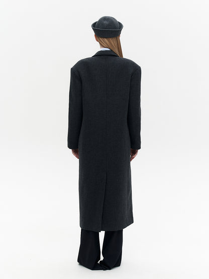 Wool coat with the blue eye patch